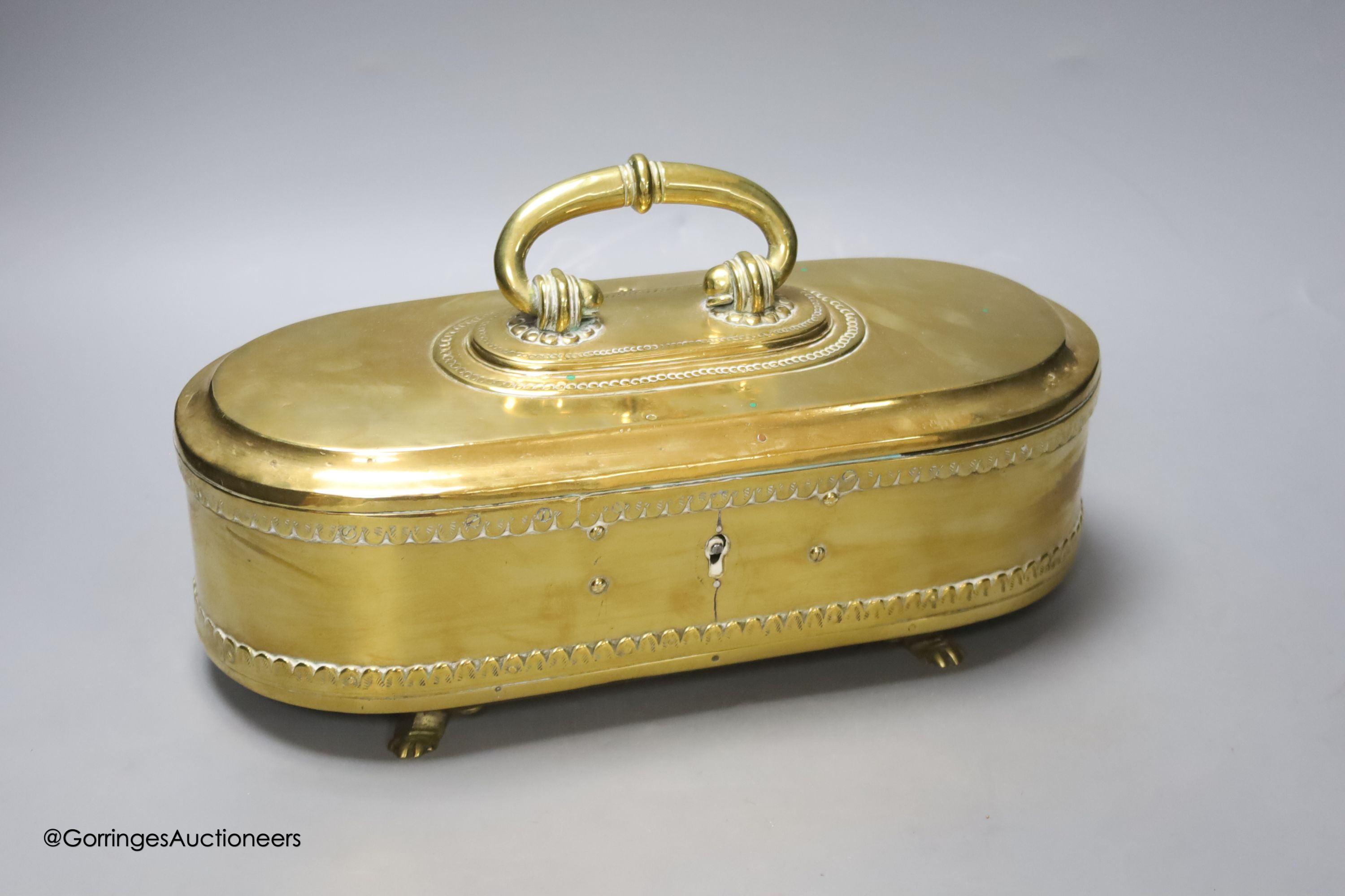 An Eastern brass lidded box, 33cm wide.